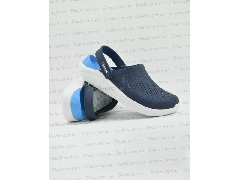 Кроксы LiteRide на банерном фоне — вид сбоку в живую